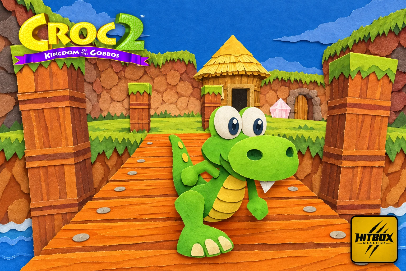 On a wooden bridge, Croc 2's little green hero grins beside a thatched hut