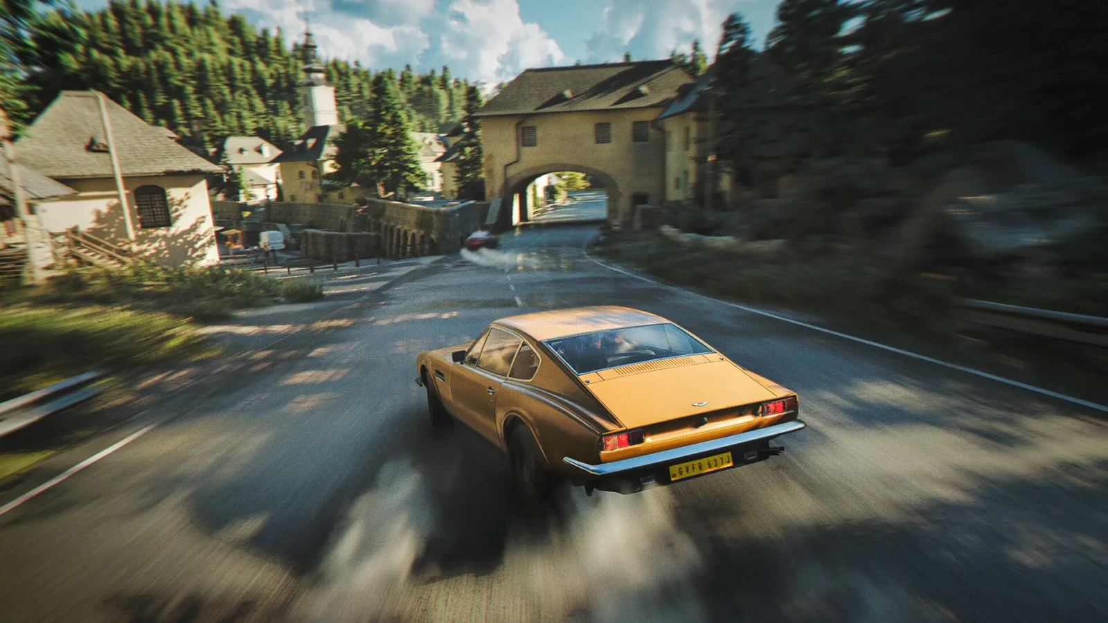007 First Light : une voiture de sport lancée sur une route de village